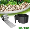 A garden bed with a metal border, and two rolls of garden border material in the foreground. Voir les images du produit