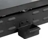 A close-up view of the bottom section of a black grill, showing a small drip tray attached. Anteprima dell’immagine prodotto