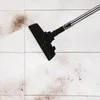 A vacuum cleaner head is shown cleaning a tiled floor with dirt. Produktbild-Vorschau