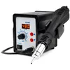 A black and silver hot air soldering station with a digital display and a handpiece resting in a stand. Produktbild-Vorschau