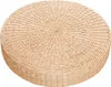 A round, woven straw cushion or mat. Produktbild-Vorschau