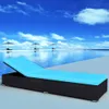 A lounge chair sits on a poolside deck next to an infinity pool. Náhľad obrázku produktu