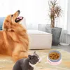 A golden retriever dog and a gray cat are in a living room setting, with a pet food bowl in the foreground. Podgląd zdjęcia produktu