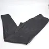A pair of black leggings folded on a white background. Produktbild-Vorschau