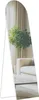 A full-length mirror with a white frame, reflecting a living room scene with a sofa, a plant, and curtains. Produktbild-Vorschau