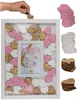A wedding guest book frame with a photo of a bride and a hand placing a heart-shaped token into the frame. Produktbild-Vorschau