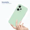 A hand holding a light green phone case. Produktbild-Vorschau