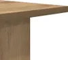 A close-up view of a corner of a wooden table or shelf. Náhled obrázku produktu