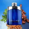 A bottle of Mont Blanc Legend Blue Eau de Parfum for men, surrounded by mint leaves and wood chips. Podgląd zdjęcia produktu