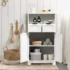 A white bathroom cabinet with storage shelves and drawers, placed in a bathroom setting with wooden brushes and a basket. Náhled obrázku produktu
