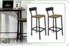 A split image showing a bar table with a laptop and two bar stools on the left, and a close-up of two bar stools on the right. Podgląd zdjęcia produktu