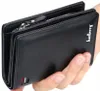 A hand holding a black leather wallet. Podgląd zdjęcia produktu