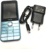 A Nokia 225 4G feature phone and its charger are displayed on a white background. Produktbild-Vorschau