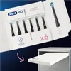 A box of Oral-B electric toothbrush heads is shown, with one head displayed separately and a pink arrow pointing to a drawer. Produktbild-Vorschau