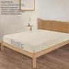 A bed with a fitted sheet on it, in a bedroom setting. Produktbild-Vorschau