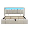 A beige upholstered bed frame with a slatted mattress base and blue LED lighting. Náhled obrázku produktu