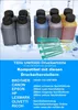 Bottles of ink and syringes arranged on a light-colored surface. Produktbild-Vorschau