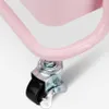 A close-up view of a pink metal serving cart's wheel with a brake. Produktbild-Vorschau