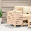 An outdoor patio scene with a wooden side table and cushions on a sofa. Produktbild-Vorschau