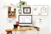 A home office setup with a computer, whiteboard, and various office supplies. Voir les images du produit