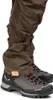 Close-up of a person's legs wearing brown pants and hiking boots. Anteprima dell’immagine prodotto