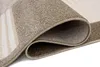 A close-up view of a rolled-up rug, showing its texture and layered construction. Produktbild-Vorschau