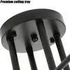 A close-up view of the ceiling mount of a black chandelier. Produktbild-Vorschau