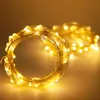 A close-up view of coiled warm white LED string lights on a copper wire. Produktbild-Vorschau