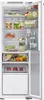 An open refrigerator with food items on its shelves. Produktbild-Vorschau