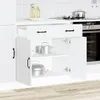 A white kitchen cabinet with pots inside, and a portion of a stove and oven visible in the background. Náhľad obrázku produktu