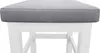 A close-up view of the top of a white wooden stool with a gray upholstered seat. Produktbild-Vorschau