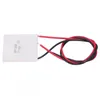 A thermoelectric generator module with red and black wires attached, isolated on a white background. Podgląd zdjęcia produktu