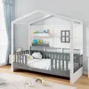 A child's house-shaped bed with protective railings, shelves, and a window detail, set in a bedroom. Anteprima dell’immagine prodotto