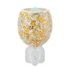 A mosaic glass electric aroma lamp plugged into a wall socket. Produktbild-Vorschau