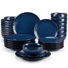 A set of blue ceramic dishes with a floral pattern and gold trim, arranged in stacks and piles against a white background. Náhled obrázku produktu