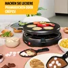 A raclette grill is set up on a table with various food items, including pancakes, bananas, marshmallows, and asparagus, suggesting a meal preparation or serving scene. Anteprima dell’immagine prodotto