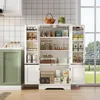 A white kitchen cabinet with doors open, displaying various kitchen items and food products. A green cabinet is partially visible on the left. Náhľad obrázku produktu