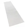 A white shaggy rug laid out on a white background. Voir les images du produit