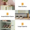 A collage of images showcasing a light green shoe cabinet with gold accents, highlighting its features. Produktbild-Vorschau