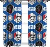 A pair of Star Wars themed curtains hanging in front of a window. Voir les images du produit