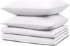 A stack of white bedding, including pillows and folded sheets, on a white background. Náhled obrázku produktu
