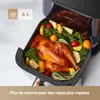An air fryer filled with a cooked chicken and vegetables. Anteprima dell’immagine prodotto