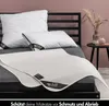 A bed with pillows and a mattress protector. Produktbild-Vorschau