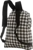 A close-up view of the back of a houndstooth patterned backpack. Produktbild-Vorschau