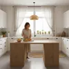 A woman is preparing fruit in a modern, bright kitchen. Produktbild-Vorschau