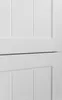 A close-up view of a white cabinet with paneling details. Podgląd zdjęcia produktu