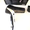 A black and silver Braun hair dryer is shown against a white background, with a portion of its packaging visible at the top. Produktbild-Vorschau
