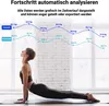 A woman is doing a yoga pose in front of a window with a graph overlay showing weight and body fat progress. Produktbild-Vorschau