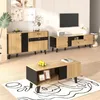 A living room setup featuring a TV stand, a coffee table, and a sideboard, all in a modern wood and black design. Produktbild-Vorschau