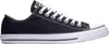 A black Converse All Star shoe on a white background. Voir les images du produit